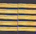 Set of two 5 gold bar Epaulettes with black background. ( 13 mm bar) 
