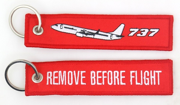 Keyholder with `Remove Before Flight ` on one side and `737`and silhouette on other side  RBF-737