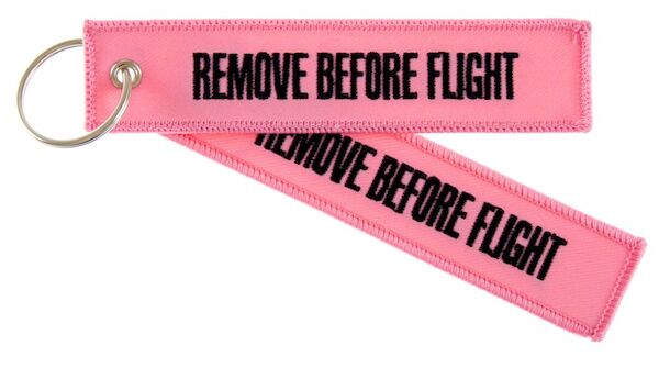 Keyholder with 'Remove Before Flight' on both sides on pink background  RBF-PINK
