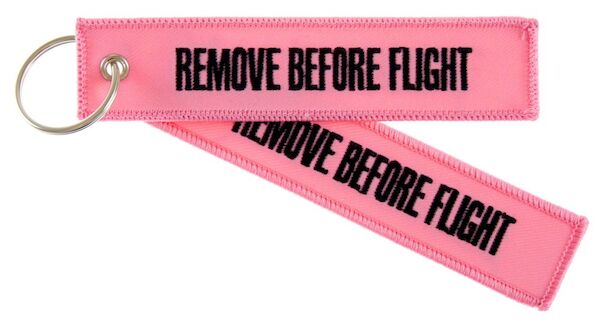 Keyholder with 'Remove Before Flight' on both sides on pink background RBF-PINK