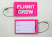 Bagagetag with FLIGHT CREW in white on pink background on one side and writable backside, including metal wire  BAGTAG FC PINK
