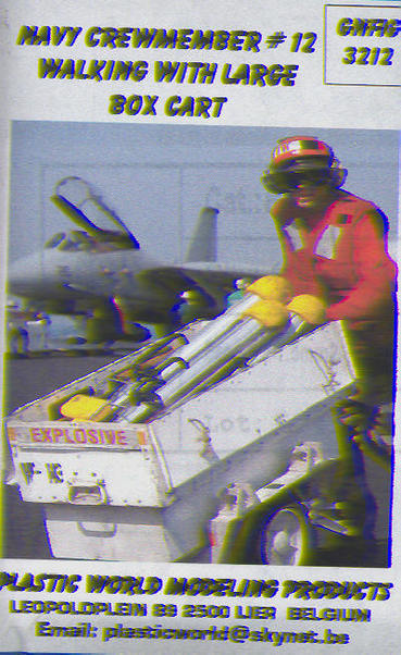 US Navy Crewmember #12 Walking with open Large Box cart GNFIG3212