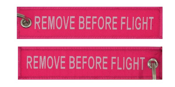 Keyholder with REMOVE BEFORE FLIGHT on both sides - pink background KEY-RBF-PINK