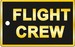 Bagagetag with FLIGHT CREW in gold on black underground on one side and writable backside, including metal wire