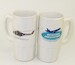 Tall Mug Lynx SH-14B MLD on one side, Aviation Megastore on other side.